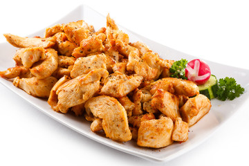 Grilled meat and vegetables on white background