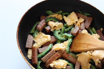 cooking of Okinawa food, spiced ham and bitter melon stir fried
