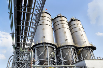 Large factory  silo under blue sky