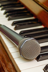 Microphone on keyboard of piano