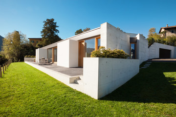 Beautiful modern house in cement, view from the garden