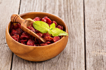 Dried cranberries in a wooden bowl