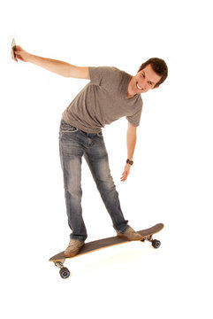 young man taking his picture on long board