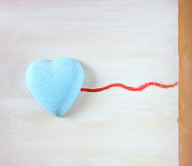 heart shape stone over canvas texture