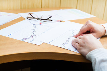 Office worker analyzing financial statistics