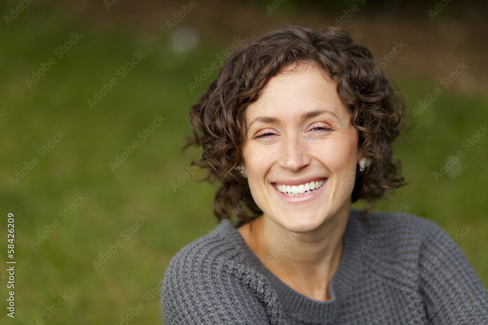 Wall mural close-up of a woman smiling