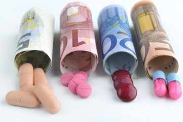 medical pills and tablets in euro bank notes money costs symbol