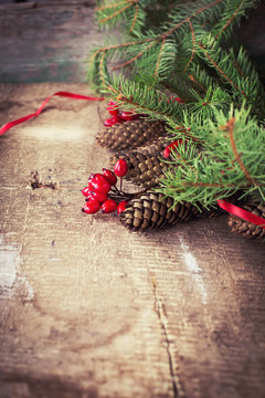 Decorative christmas composition on wooden background.