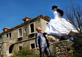 Bride pushing the groom in a different wedding scene