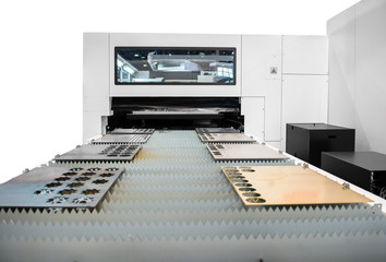 Machine cutting steel in a factory