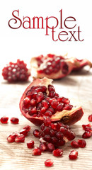 Fresh and juicy pomegranate fruit on wood