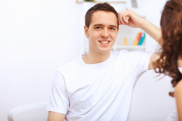 Fototapeta premium Young happy couple at hone together s