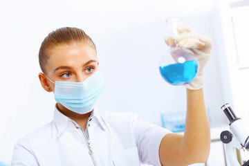 Young female scientist working in laboratory