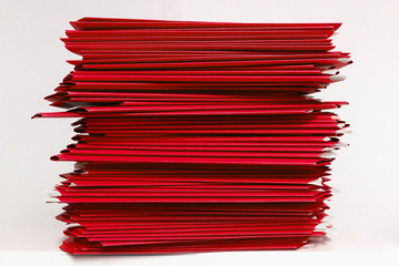 stacks of red folders over white background