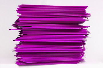 stacks of purple folders over white background