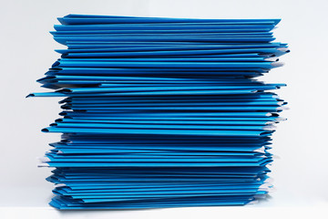 stacks of blue folders over white background