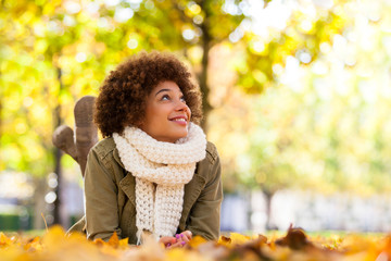 Autumn outdoor portrait of beautiful African American young woma