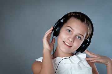 Portrait of beautiful girl on gray background