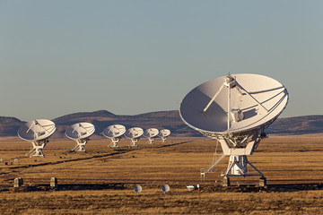 Very Large Array satellite dishes at Sunset in New Mexico, USA