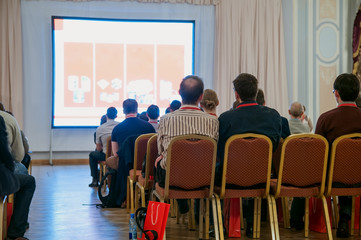 people sitting at the business conference