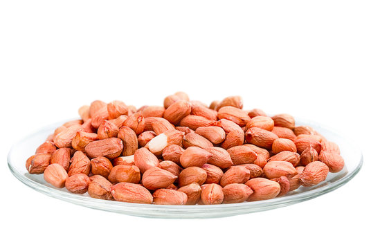 heap of raw peanuts in a saucer