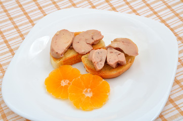 Cod liver with tangerines.