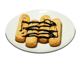  Biscotti with drizzled chocolate on white plate