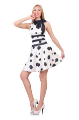 Tall model dressed in dress with polka dosts on white