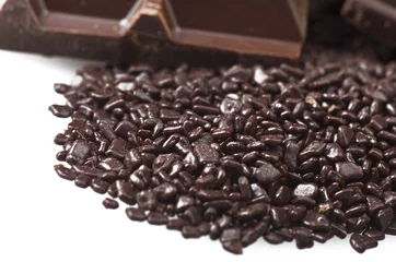 Gardinen Closeup detail of chocolate parts on white background. © Orlando Bellini