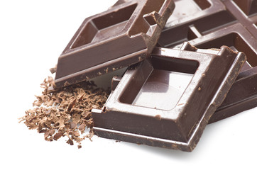 Closeup detail of chocolate parts on white background.