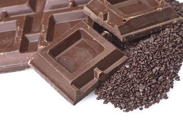 Closeup detail of chocolate parts on white background.