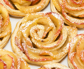 Sweet rolls with apples in the form of roses on plate