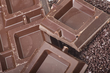 Closeup detail of chocolate parts on white background.