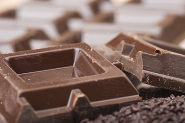 Closeup detail of chocolate parts on white background.