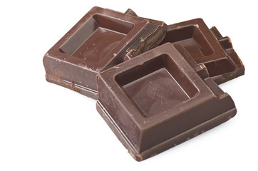 Closeup detail of chocolate parts on white background.