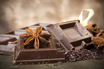 Fototapeten Closeup detail of chocolate parts on white background. © Orlando Bellini