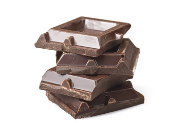 Closeup detail of chocolate parts on white background.