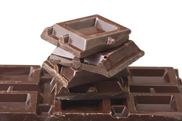 Closeup detail of chocolate parts on white background.