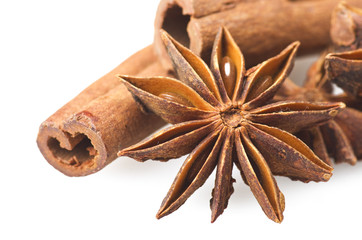 Cinnamon sticks and star anise close up on the white