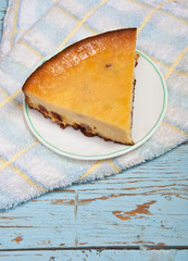 piece of cheesecake on the old wooden table
