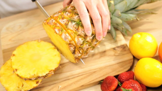 Fresh Tropical Pineapple Fruit Being Sliced Hands Only