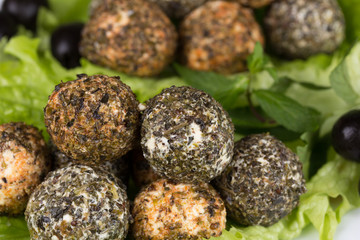 mozzarella balls with different spices and olives