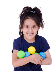Fototapeta premium Happy little girl playing with colourful balls