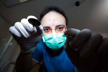 Crazy sadist dentist torturing a patient