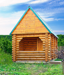 Fototapeta na wymiar Log house on a background of nature
