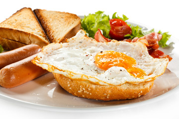 English breakfast - toast, egg, bacon and vegetables