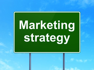 Advertising concept: Marketing Strategy on road sign background