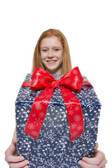Young red haired Girl presenting a gift