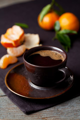 Cup of coffie and clementines