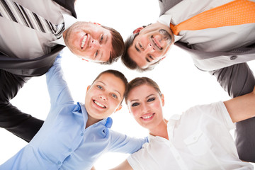 Obraz na płótnie Canvas Huddle Of Happy Businesspeople